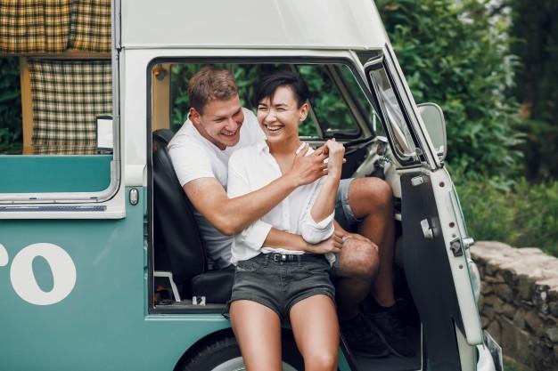 couple_hugging_in_the_doorway_of_a_campervan